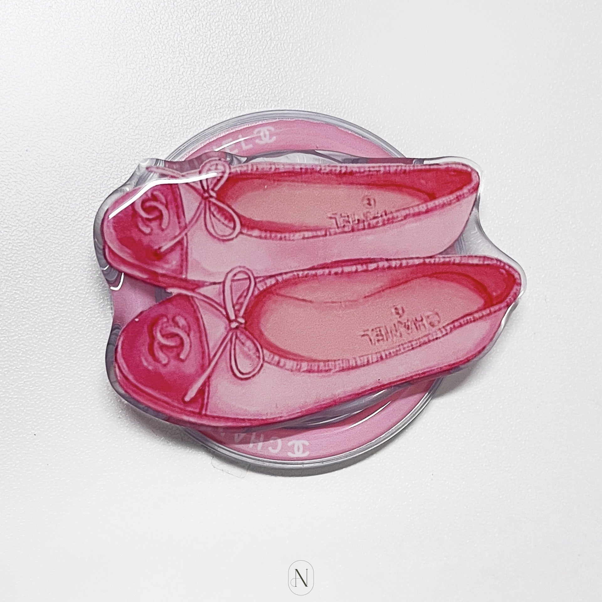 Pink shoes Chanel Ballets Flat Grip with a bow design on a clear background